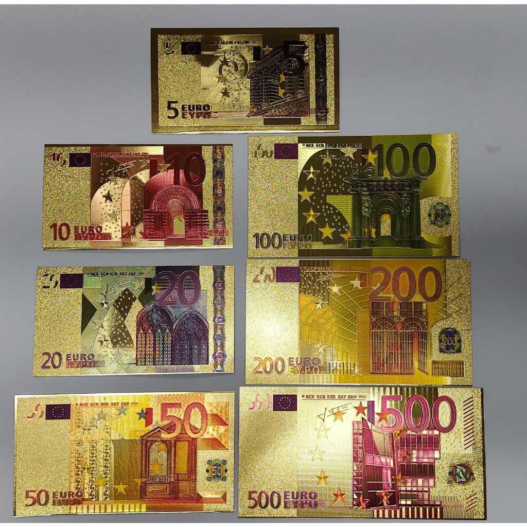 7 CÉDULAS DOURADAS DE EURO (SOUVENIRS) FANTASIA, APENAS DECORATIVAS OU PRA COLEÇÃO.